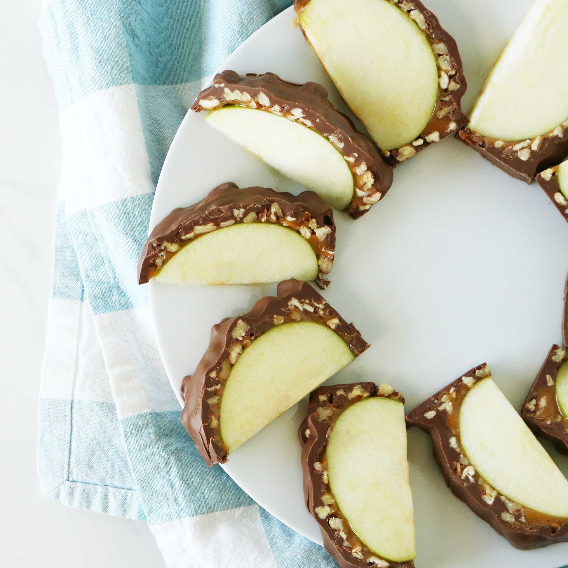 Caramel Apple with Nuts Slices on a plate 